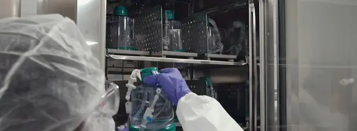 Scientist using ScaleReady G-Rex technology in a CGT manufacturing laboratory