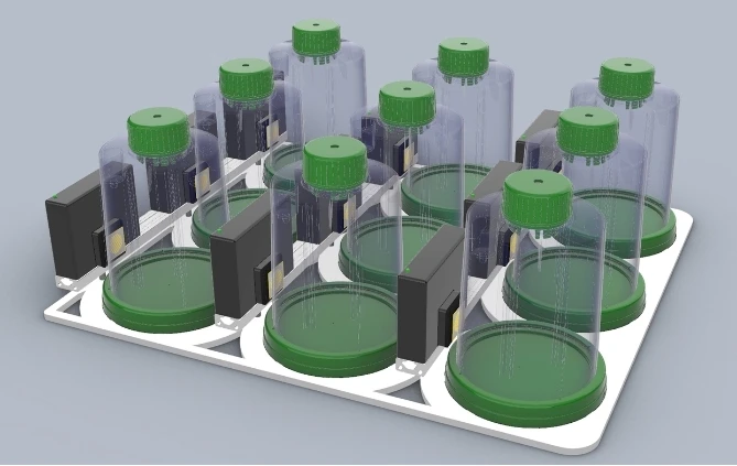 Side view of nine SMART G-Rex bioreactors arranged in a 3x3 array of continuous readers, showing the vertical structure of integrated metabolite sensors