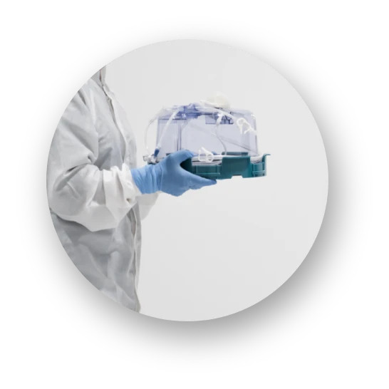 Researcher holding a G-Rex 500M-CS closed-system bioreactor — preclinical protocols transfer linearly to commercial-scale cell therapy manufacturing