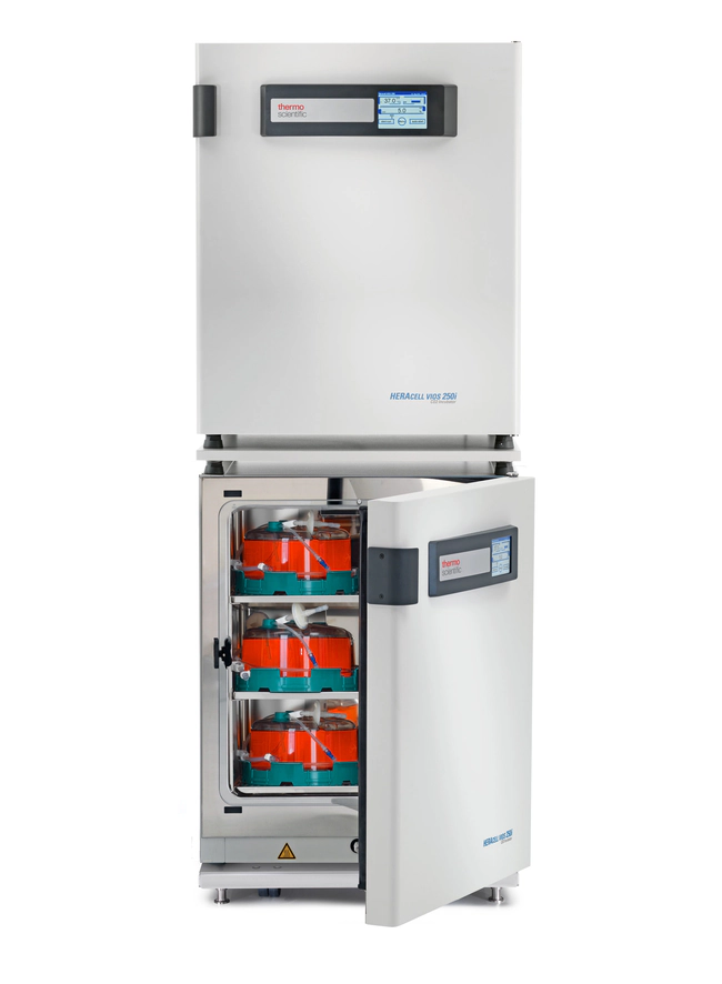 Two stacked CO2 incubators, the lower one open and loaded with G-Rex bioreactors